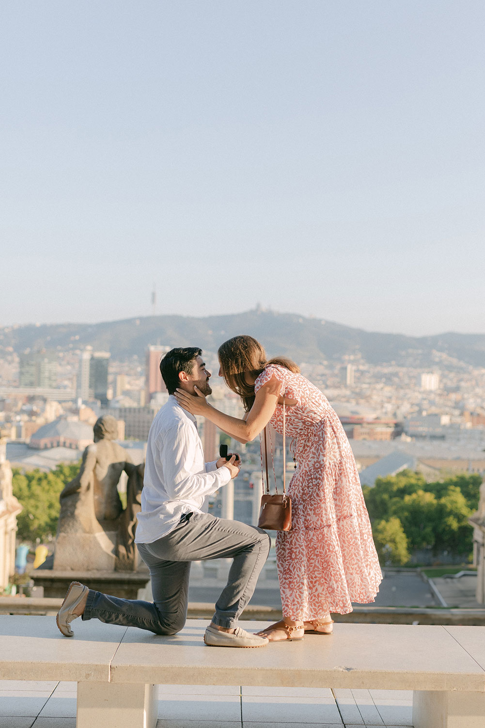 Young lady hugging her fiance after a Picture Perfect proposal at Montjuic, in Barcelona