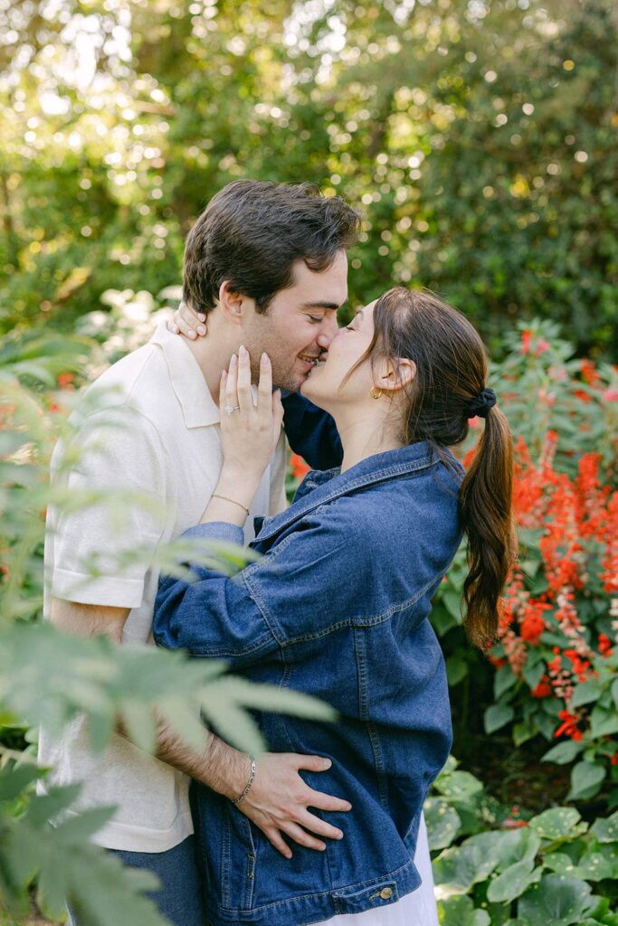 Young couple kissinf among the beautiful greenery after their marriage proposal at MArimurtra Botanical Garden | Costa Brava Surprise Marriage Proposal