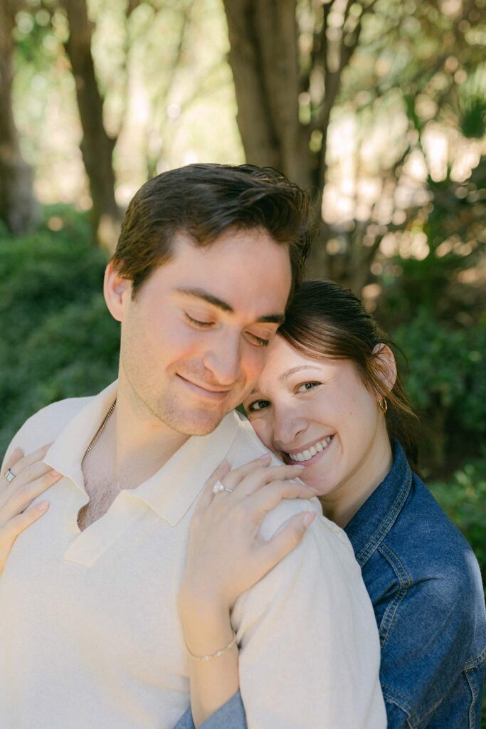 Young couple hugging at engagement photo session on marriage proposal at MArimurtra Botanical Garden | Costa Brava Surprise Marriage Proposal