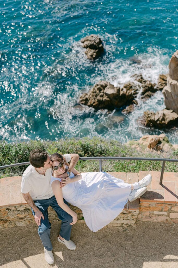 Young couple on the cliff after their marriage proposal at MArimurtra Botanical Garden | Costa Brava Surprise Marriage Proposal